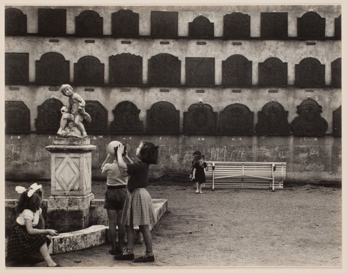 [Children playing playing in a courtyard]