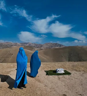 Two people standing outside.