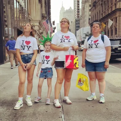 street portrait of family wearing I heart nyc shirts