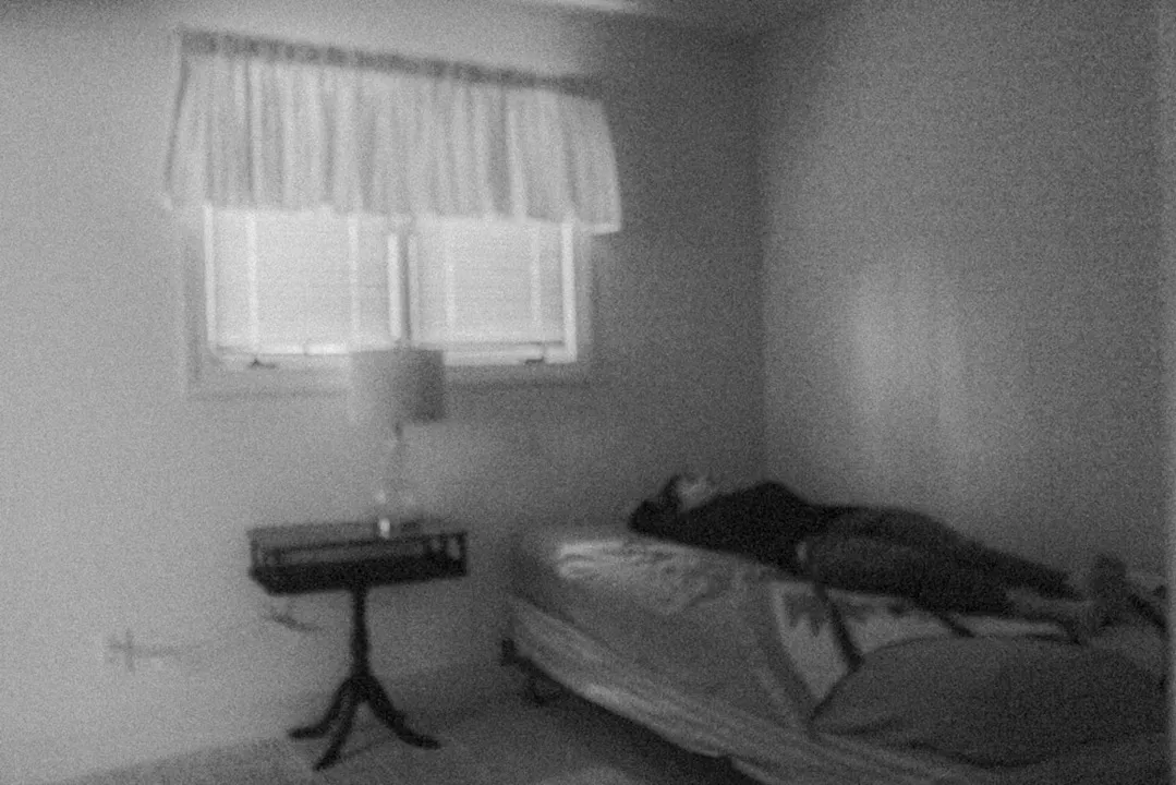 A lady laying in bed.