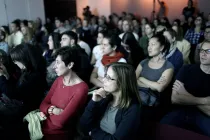 A group of people at an lecture.