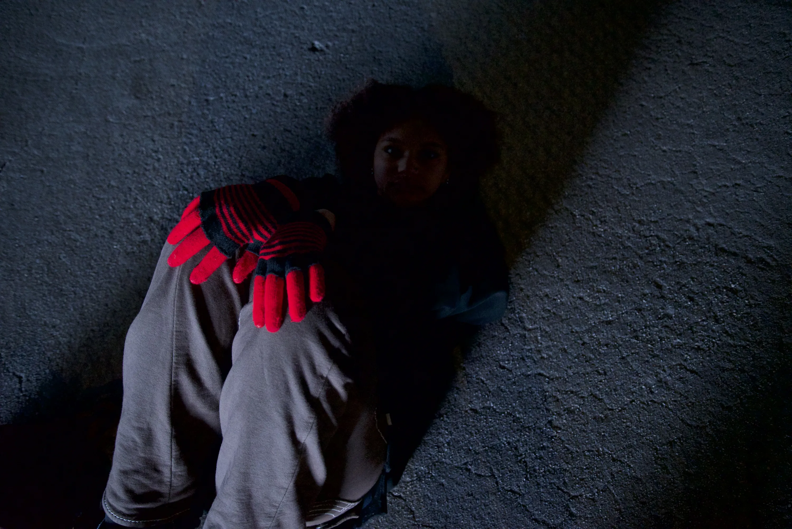 Kid on the flooring holding her knees