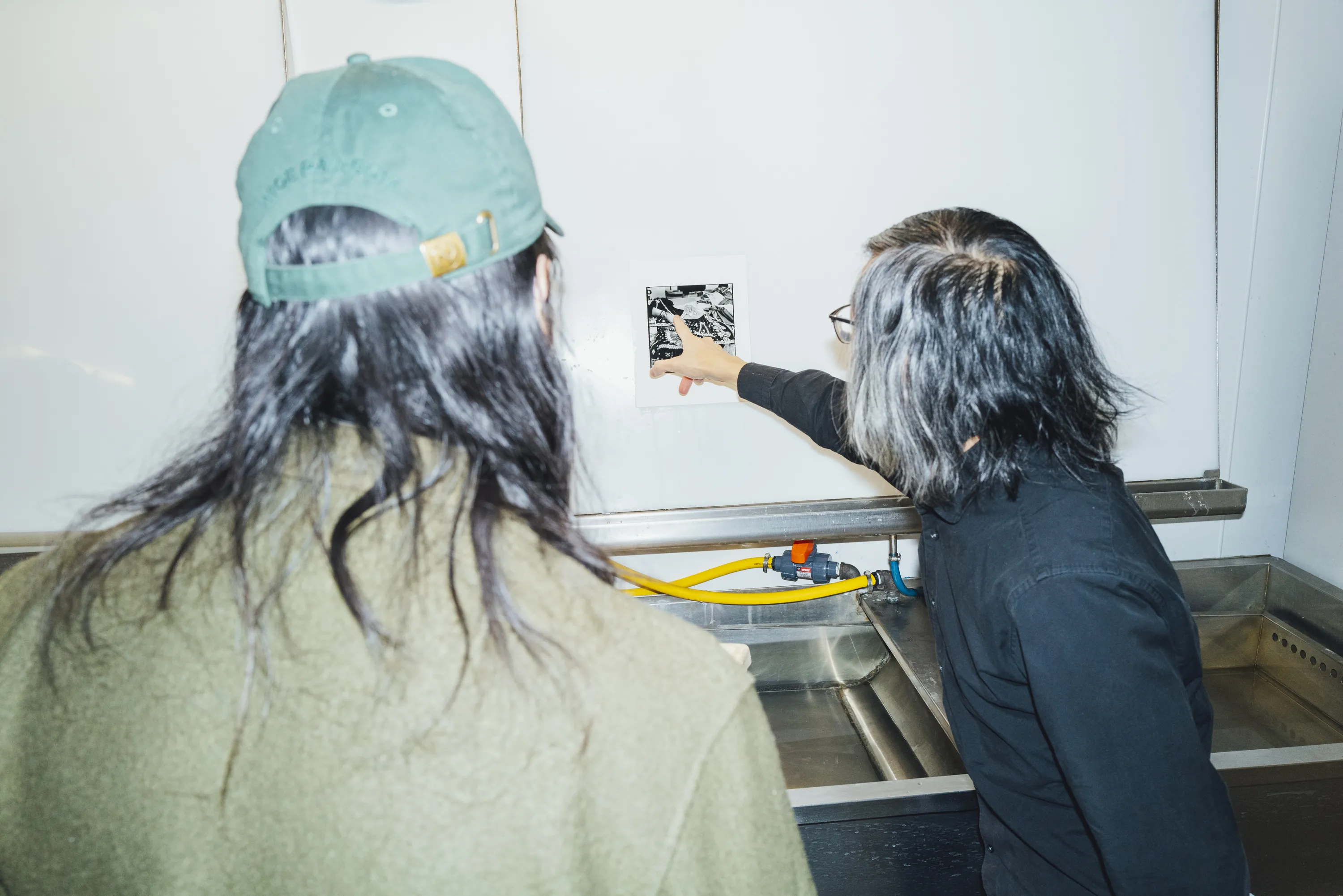 Student and instructor working in darkroom