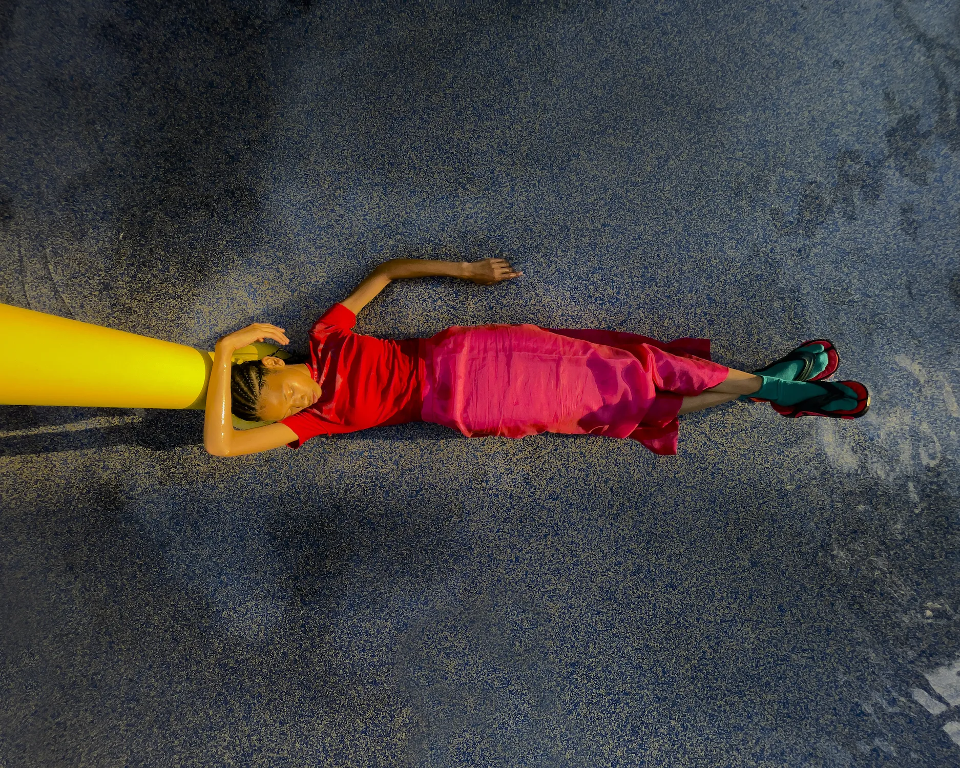 A woman laying on the floor.